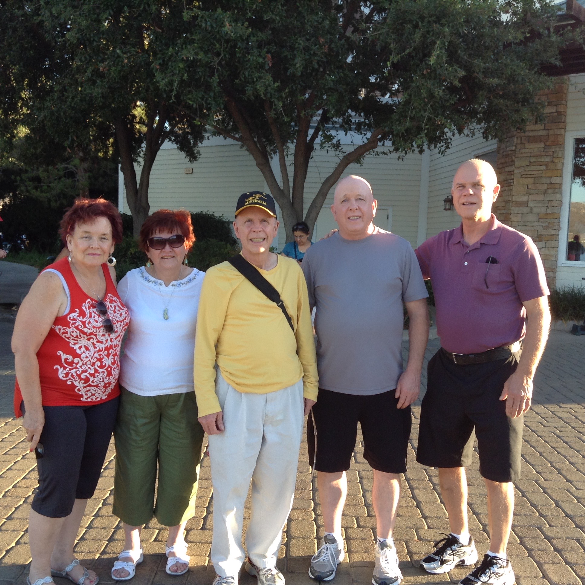 Tom with a group of friends outdoors